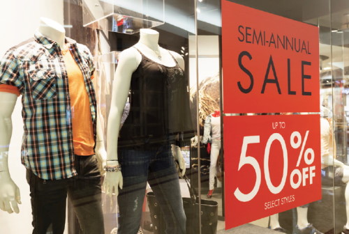 Example of a window sign showing a sale on clothing.